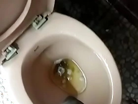 Indian boy pissing in toilet