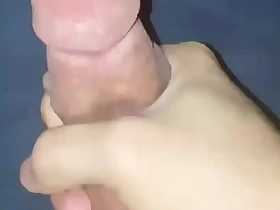 Horny teen boy stroking his cock