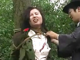 Chinese army girl tied to tree 1
